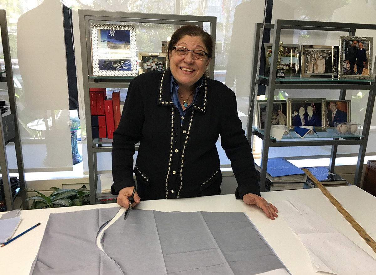 Claire cutting a custom blouse in her showroom in Beverly Hills.